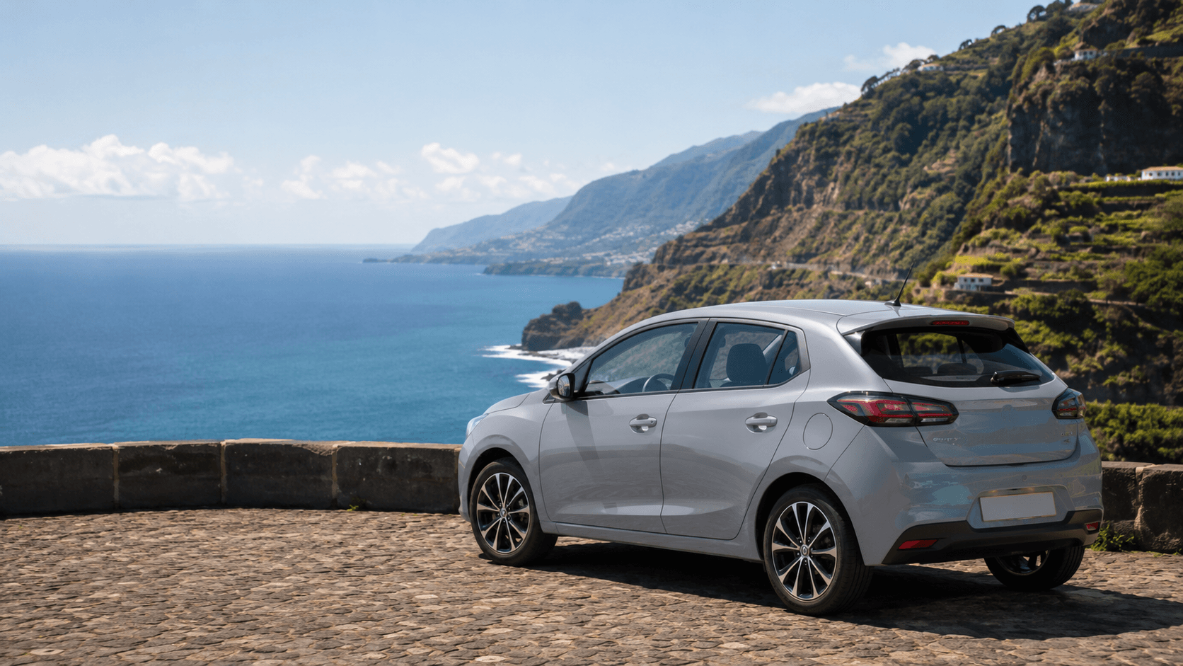 Compact rental car at a scenic Madeira coastal viewpoint